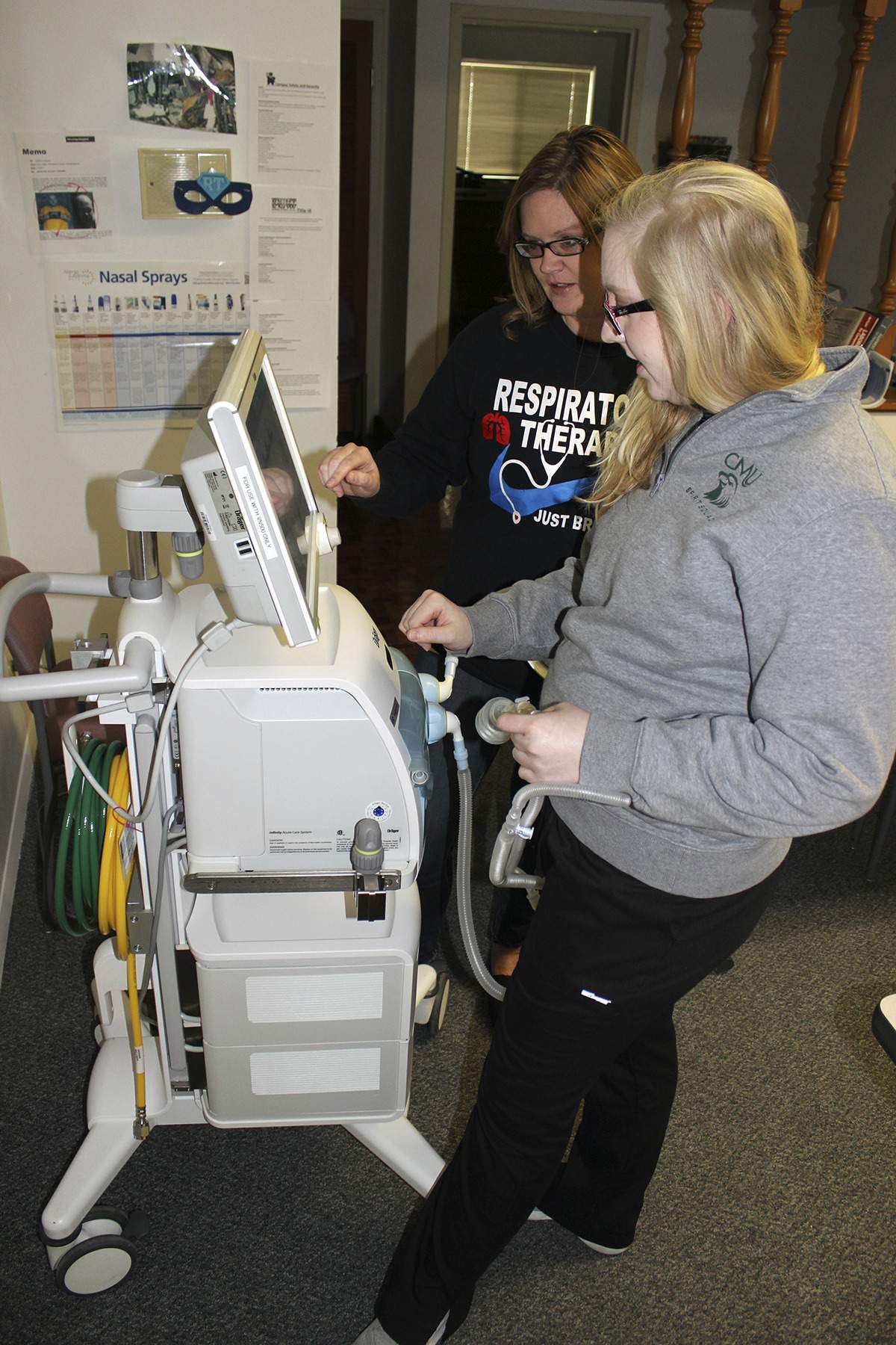 Good Press: AARC Student Members Kim Hiatt and Teddie Neil working on neonatal ventilator.