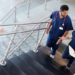 photo of two medical professionals walking up a staircase