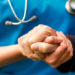 image of RT holding hand of a patient